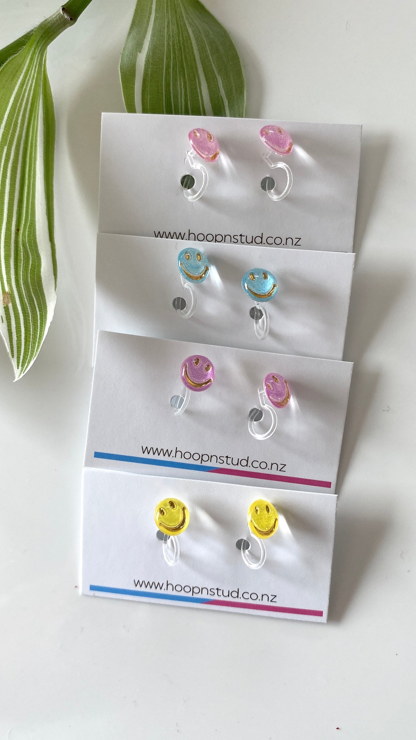 Smiley face studs