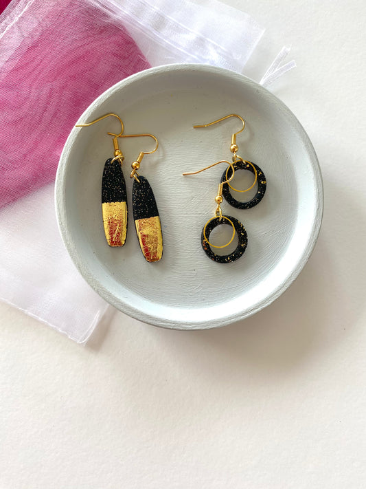 Black and gold earrings