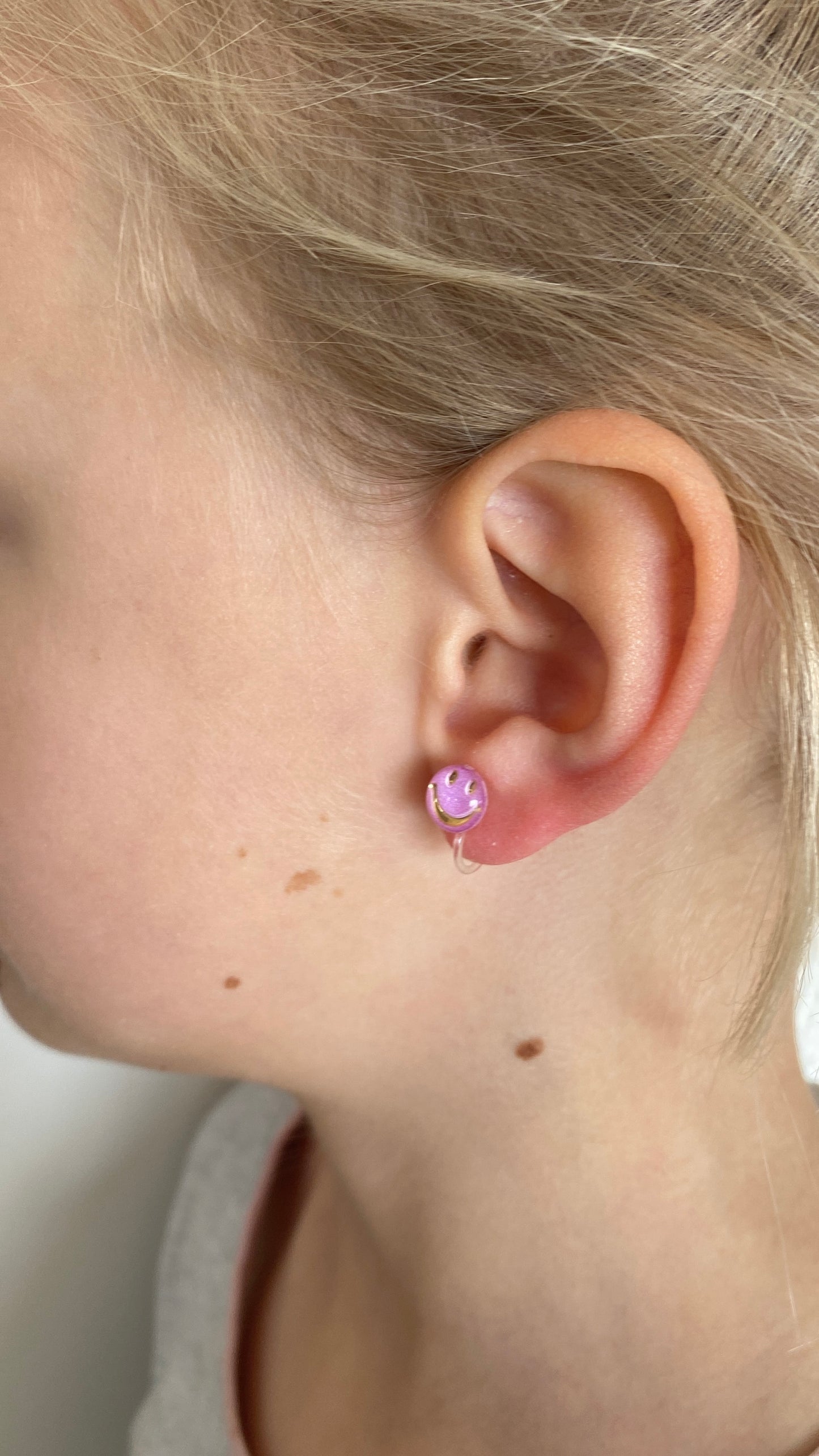 Smiley face studs